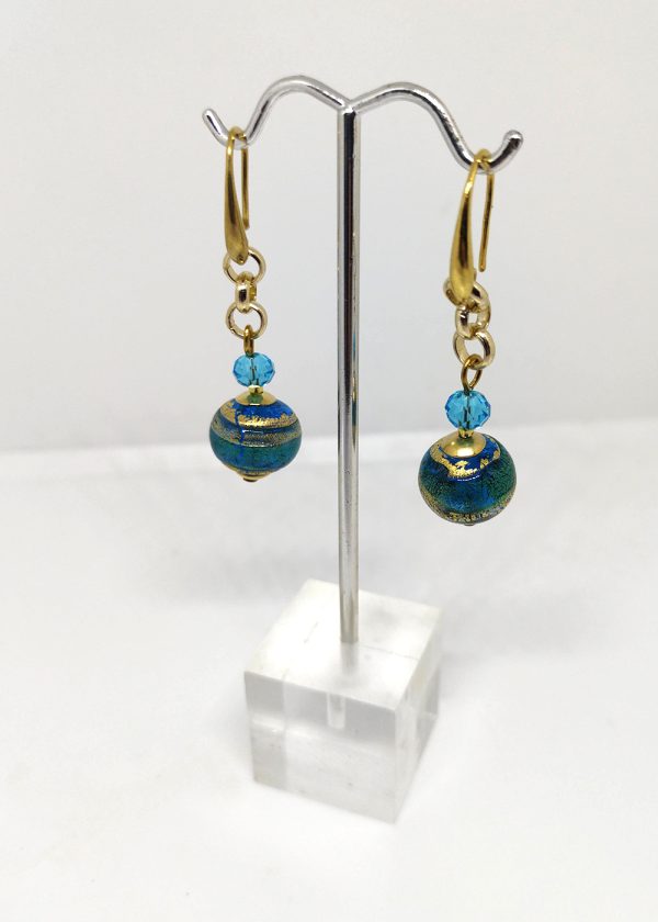 Glass earrings each with 2 beads: a small one in light, clear sky blue and a big one with blue and gold.