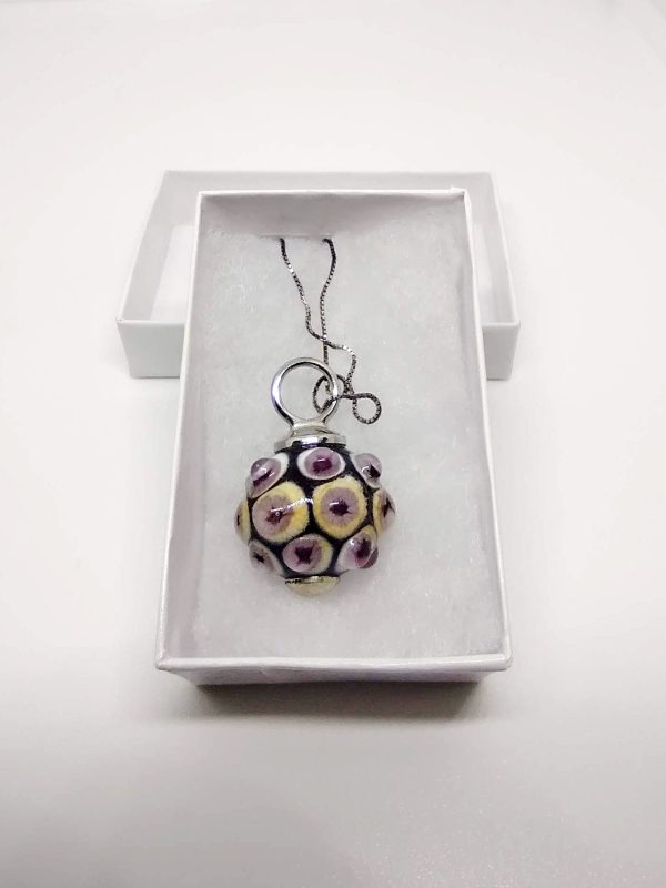 Necklace with a pendant made with a bubbly effect, with a delicate fusion of colors including pristine white, vibrant yellow, captivating cyclamen purple, and soft powder pink. Chain in silver color.