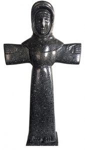 A black granite sculpture of Saint Francis. Small details lining his fands, hands and feet. Standing with arms out wide.