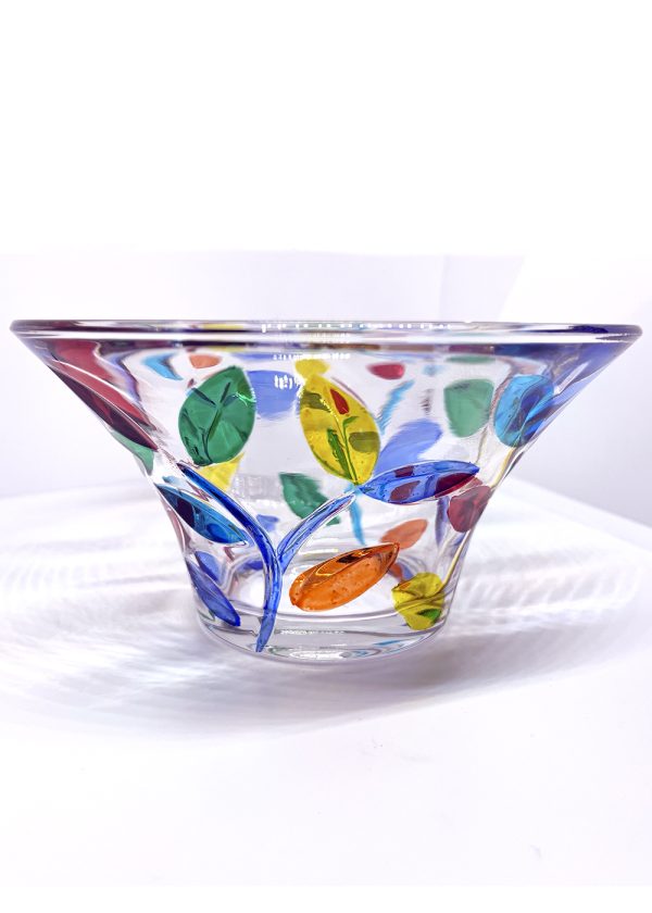 Small pieces were made in Murano glass with a flower vine design repeated in a pattern. The stems are in blue, while the leaves are in green, yellow, orange, red, and blue tones.